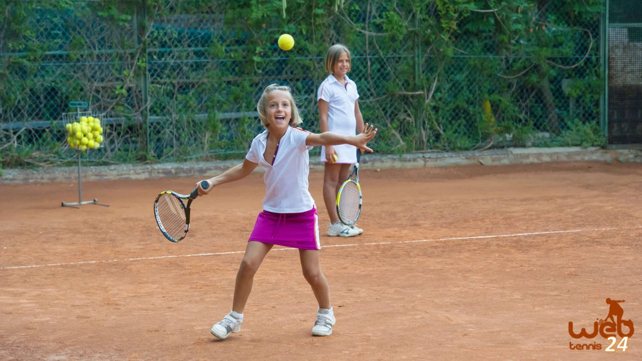 children playing tennis