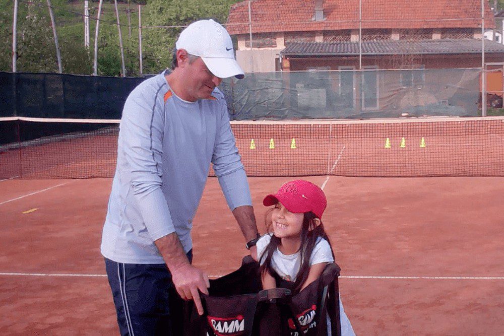 tennis coach and daughter