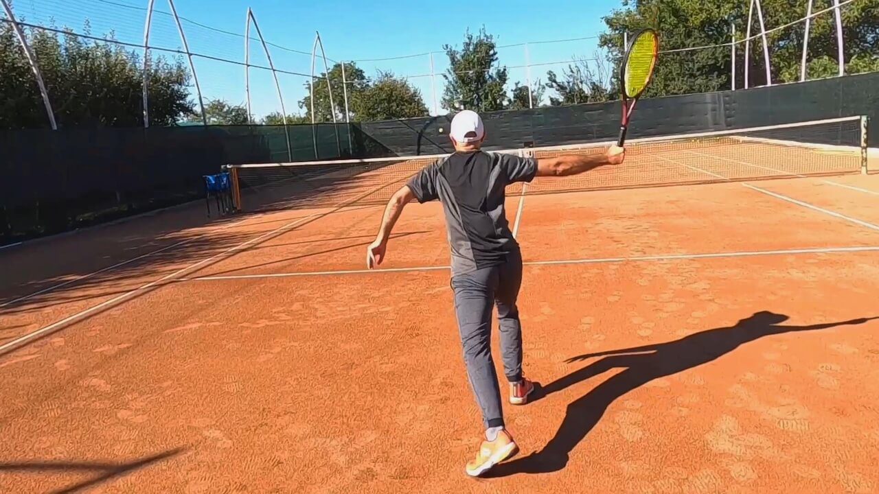 tennis player transitioning from baseline to net